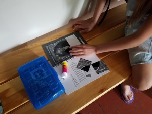 Girl making puzzle closeup