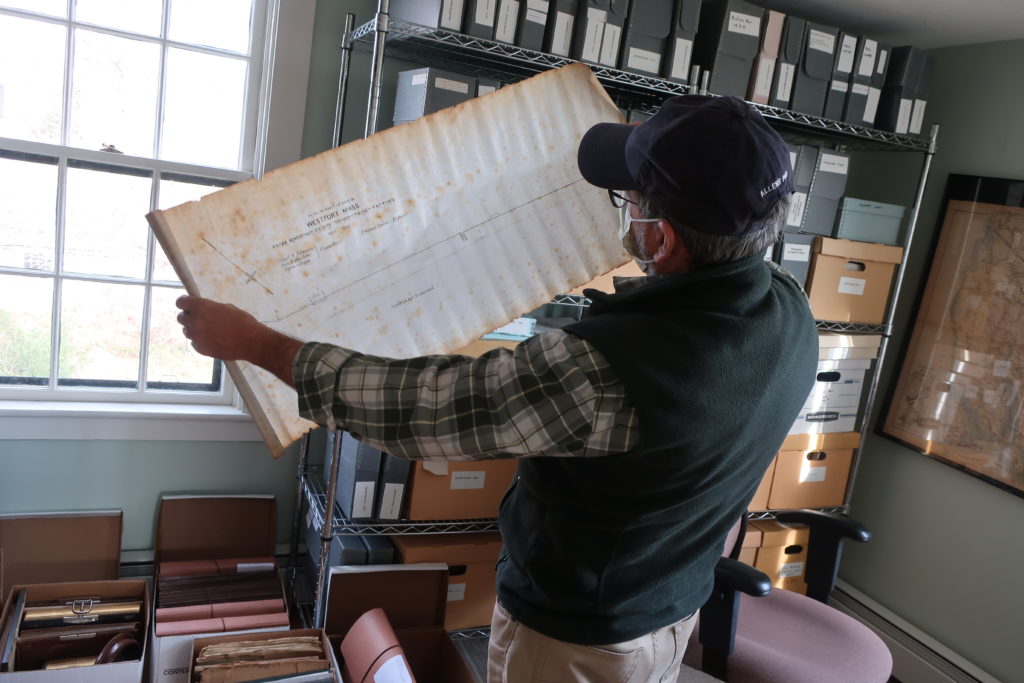 Michael Labossiere examines a map from the Sherman family collection.